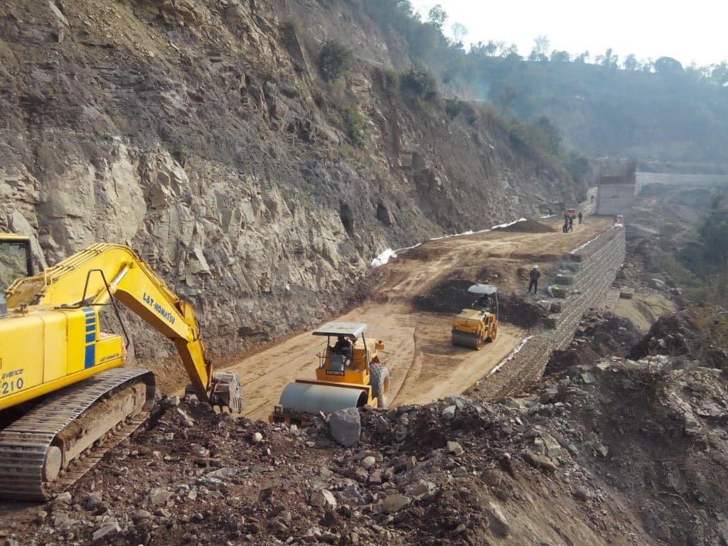 Road construction with gabion wall